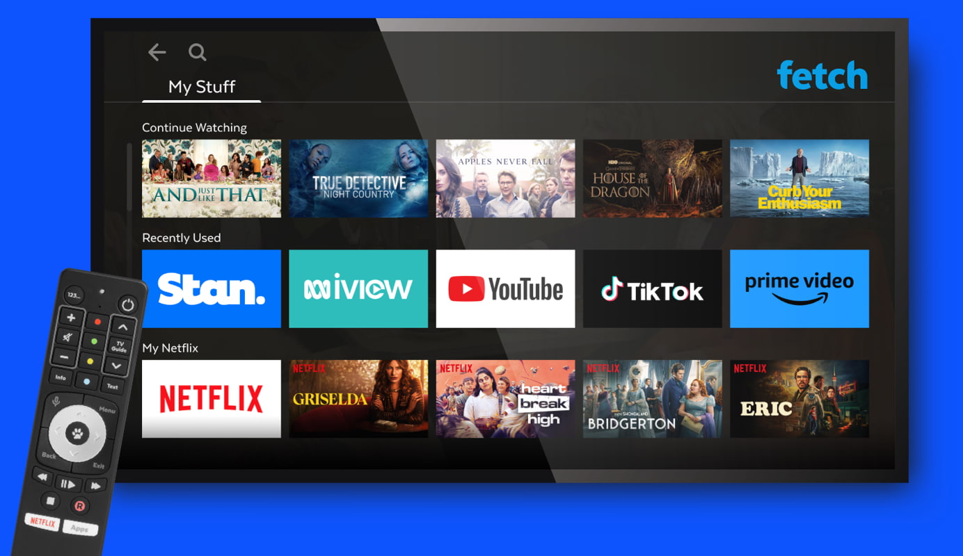 Image depicts the Fetch user interface displayed on a TV with various app thumbnails along with the fetch remote control